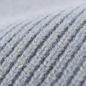Deep grey ribbed knit beanie hat with golden yellow yarn details for outdoor winter wear