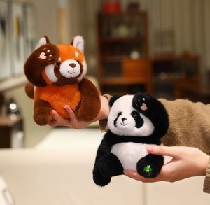 Close-up of cute plush pandas featuring embroidered heart paws and soft plush texture