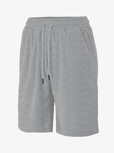 Detail of light gray casual shorts featuring herringbone jacquard texture and drawstring