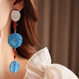 Silver needle asymmetric tassel earrings with red coral beads and blue marble pendants