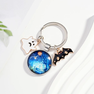 Halloween keychain with white ghost, bat pendant and starry forest glass gem charm