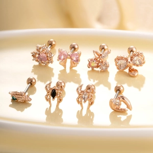 Rose gold ear stud set with bow, heart, and spider shapes featuring colorful zircons