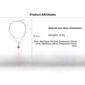 Detail showing dimensions of vintage double-layer cross necklace with red rhinestones