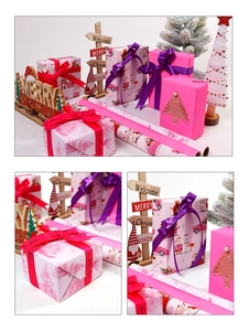 Macro view of pink Christmas wrapping paper with festive patterns and silk ribbon texture
