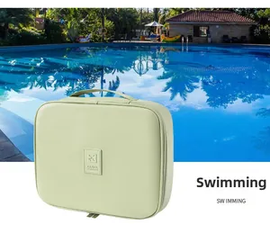 Waterproof light green PU travel cosmetic bag with sturdy handle and TRAVEL logo