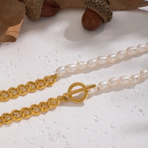 Detail shot of natural freshwater pearl necklace with golden OT buckle and metal chain link