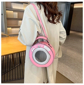 Unique pink washing machine shaped crossbody bag with round window and top handle details