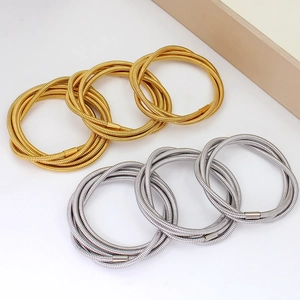 Modern multi-layer spiral wire bracelets in gold and silver stainless steel finish