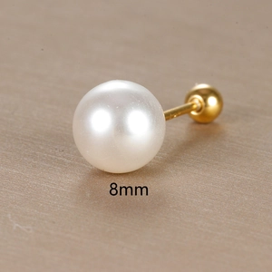 Minimalist 8mm white pearl stud earring with 18K gold plated backing on metallic background