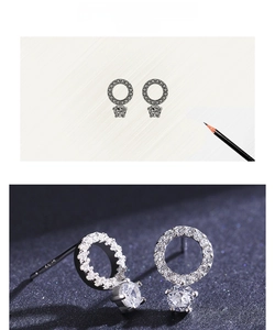 Macro detail of S925 sterling silver stud earrings with pavé cubic zirconia design