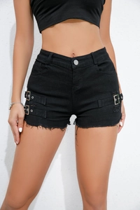 Detail of high waisted black denim shorts featuring metal side buckles and frayed hems