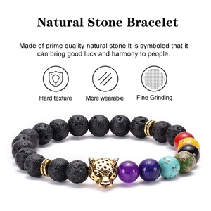Lava rock stone bracelet with leopard head and multicolor chakras on white background