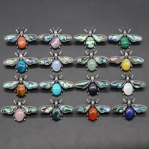 Bee-shaped brooches set with colorful agate gemstones and abalone shell wings