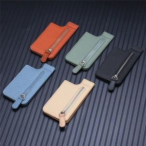 Flat lay of colorful woven texture phone wallet cases with durable metal zippers