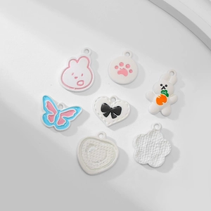 Set of 7 white enamel animal and flower charms for DIY jewelry making and crafts