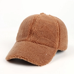 Detail view of caramel faux shearling baseball cap with thick teddy velvet texture