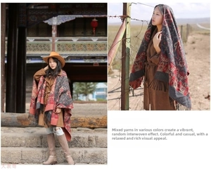 Detail of bohemian ethnic cashmere shawl with red and grey yarn textures and fringe