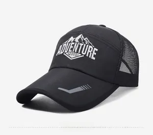 Detail of black mesh baseball cap with Adventure 2025 embroidery and reflective brim