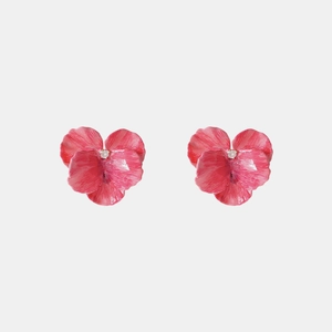 Detail of 3D floral stud earrings with pink enamel finish and a central sparkling crystal