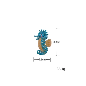 Detailed seahorse hair claw clip in blue marble acetate measuring 8.8cm in height