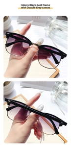 Detail of half-frame sunglasses with black top bar, gold metal rim and grey lenses