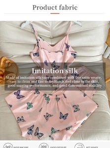 Detailed view of pink floral imitation silk pajama set featuring a camisole and shorts