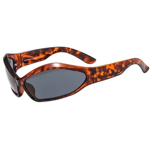 Retro tortoise shell sunglasses with wide legs and smoke grey lenses in a streamlined wrap design