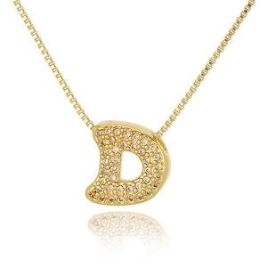 Macro shot of gold-plated D-letter pendant with pavé cubic zirconia on box chain