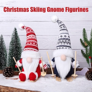 Charming Christmas gnomes on wooden sleds with knitted hats and skiing accessories
