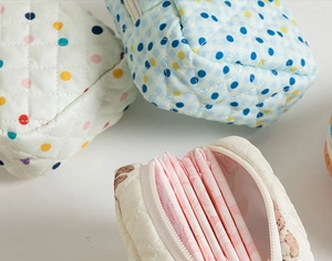 Quilted floral cotton pouches with zipper and soft padding for feminine hygiene products