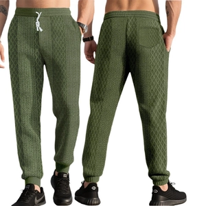 Olive green men's jogger pants featuring diamond jacquard texture and drawstring waist