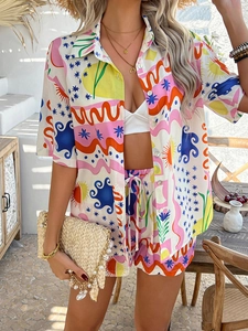 Detail of bohemian two-piece set with vibrant abstract graffiti print in a resort setting