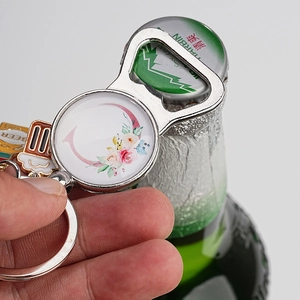 Letter C floral metal bottle opener keychain with a beer mug charm and ring attachment