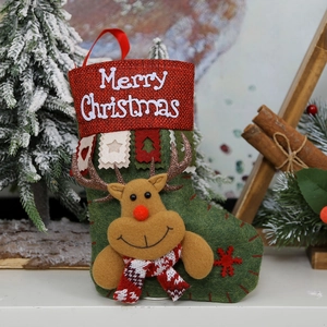 Detail showing 3D reindeer decor and Merry Christmas embroidery on a felt stocking