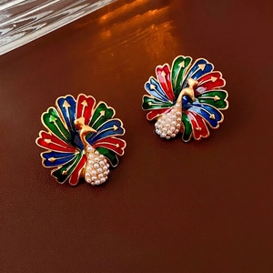 Vintage peacock earrings in gold plating with colorful enamel and white pearls
