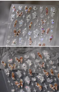 Macro detail of laser aurora butterfly nail stickers with faux pearl accents and stars