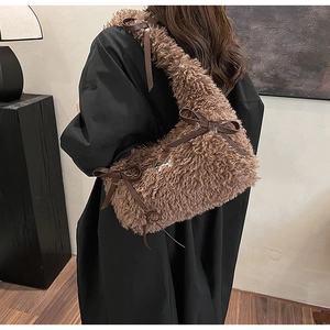 Brown fluffy teddy plush underarm bag with dark leather straps and sweet ribbon bows