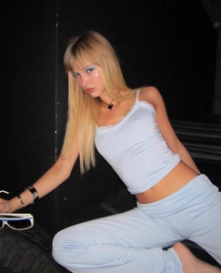 Close-up of light blue lace trim on modal camisole and pants set in Y2K aesthetic