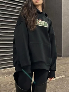 Women's black heavyweight cotton hoodie featuring DONE graphic print in a street style