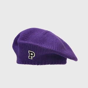 Detail of purple knit beret featuring black 'P' patch embroidery and soft wool texture