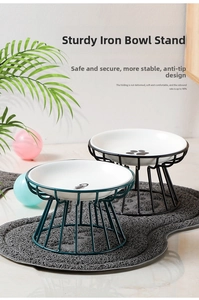 Detail of pet double ceramic bowls with iron stand featuring fishbone and paw prints