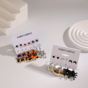 Halloween earring set featuring witch, pumpkin, and ghost charms in colorful enamel finish