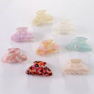 Eight colorful acetate jaw clips for women in marble and floral patterns for hair