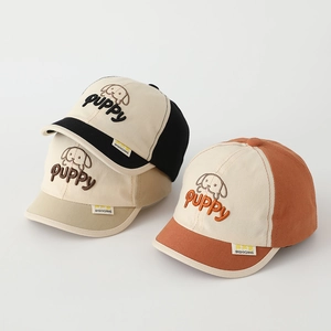 Detail of baby baseball hats with puppy embroidery and high-quality cotton texture