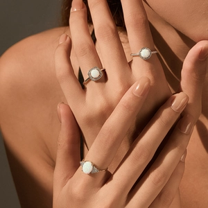 Three elegant S925 silver opal rings in gold finish with sparkling halo diamonds