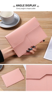 Macro detail of pink PU leather passport holder with lychee texture and fine stitching