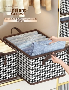 Detail showing foldable houndstooth organizer bin for jeans storage with brown handles