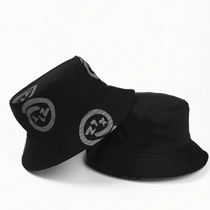 Detail view of cotton bucket hat featuring graffiti smile print and reinforced stitching