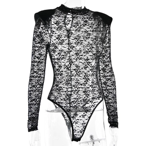 Detail of black sheer lace bodysuit featuring padded shoulders and hollow-out lace patterns
