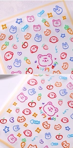 Detailed macro view of colorful cartoon animal nail stickers with bears and cute hearts